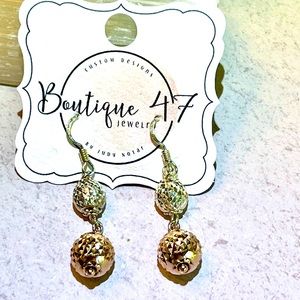 Sterling Silver drop earrings.
